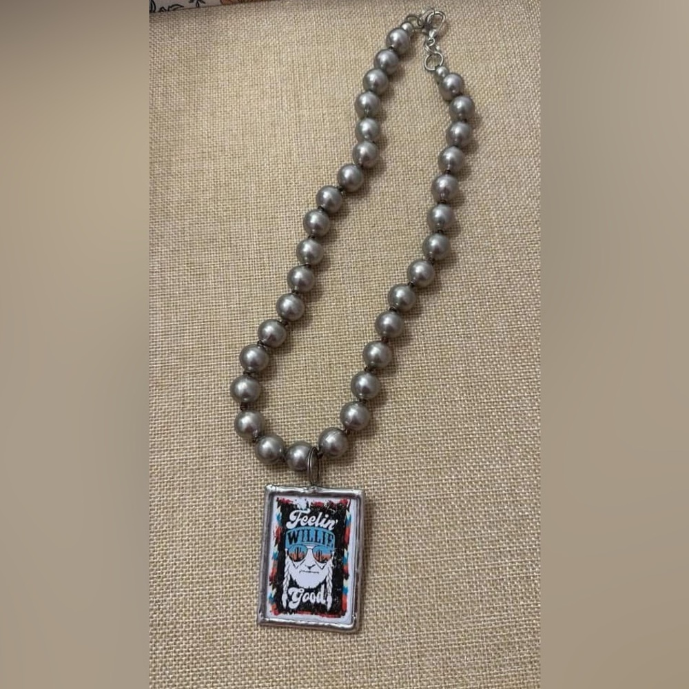 New chunky Willie Nelson necklace.  20 inches in length.